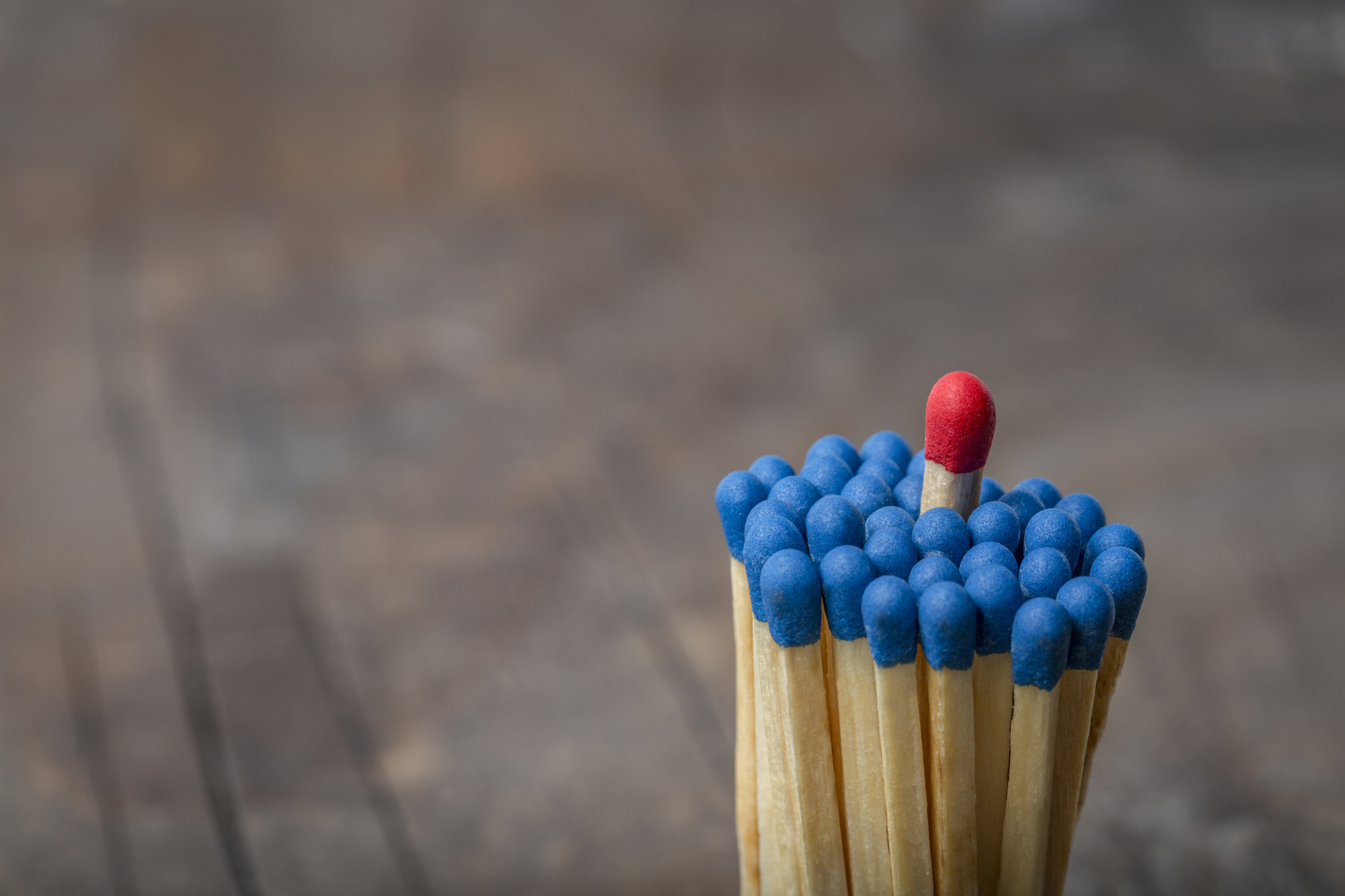 Red Match in group of blue matches