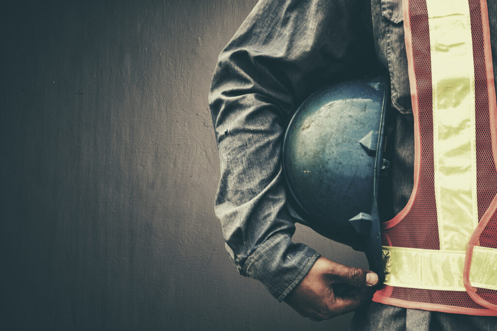 Man holding blue helmet close up