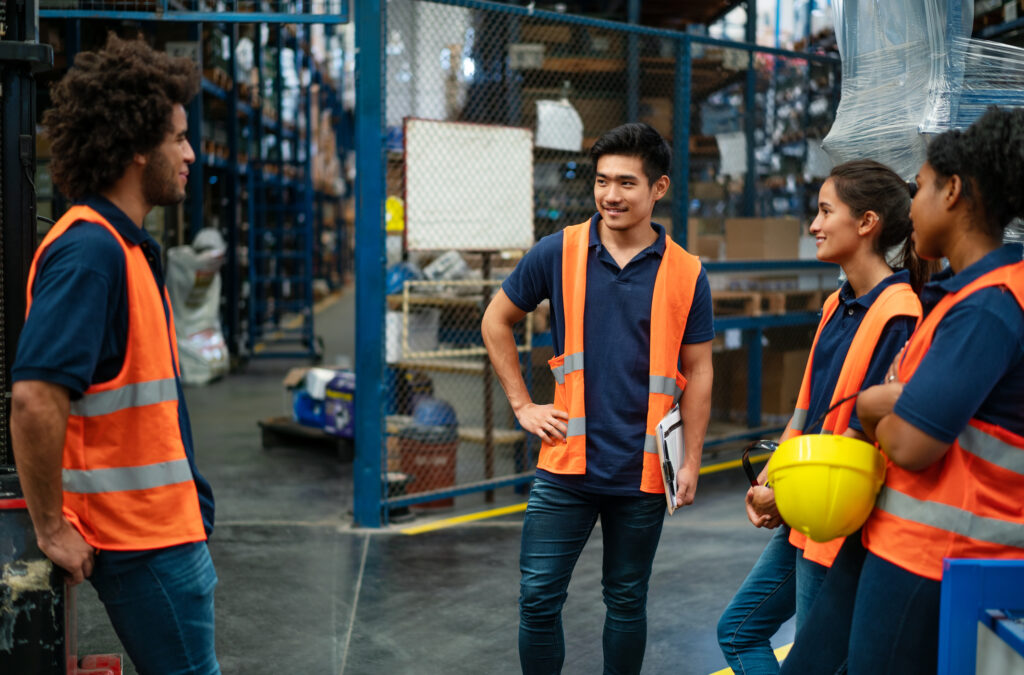 Group of warehouse workers having a meeting