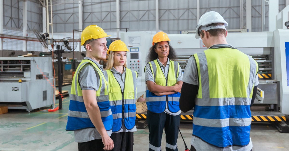 team-talking-and-working-together - Worksite safety KPA