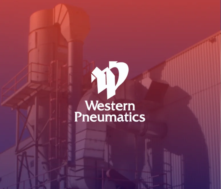 Industrial equipment and piping outside a building with the Western Pneumatics logo centered in white over the image.