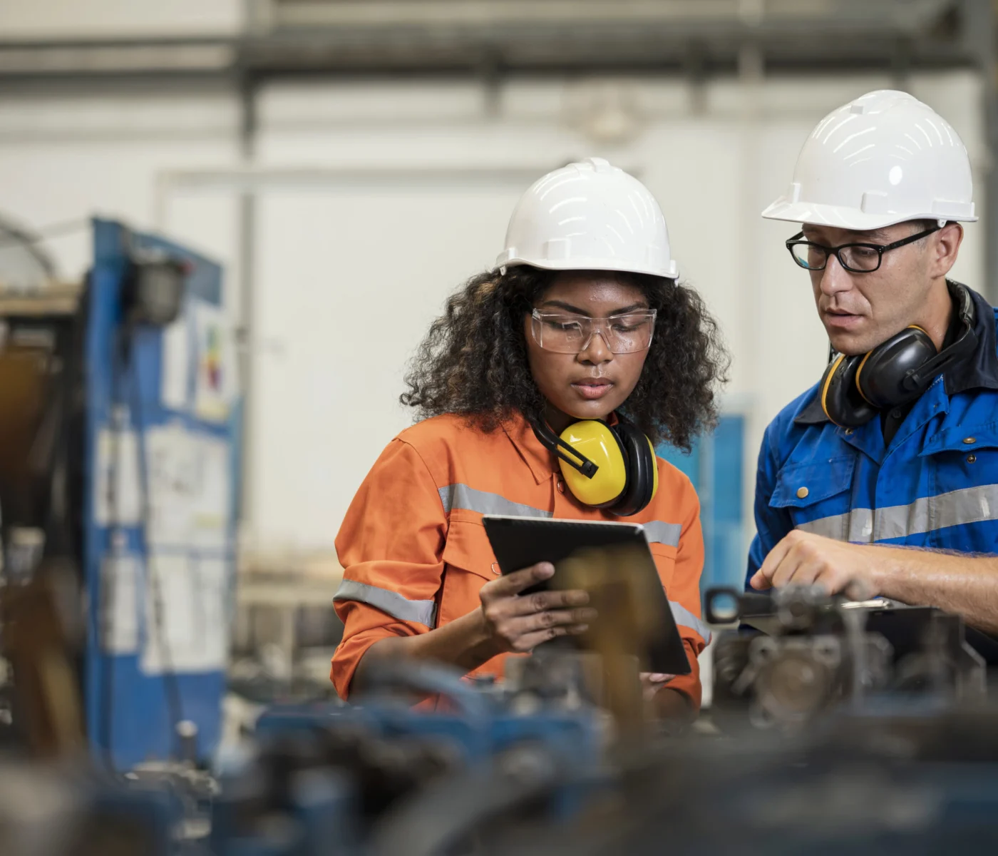Productivity Improvement of Welding Assembly Lines in Manufacturing Industry. Manufacturing Process Engineers having discussion on welding jig design data to improve and reduce defect loss of work piece in welding process.