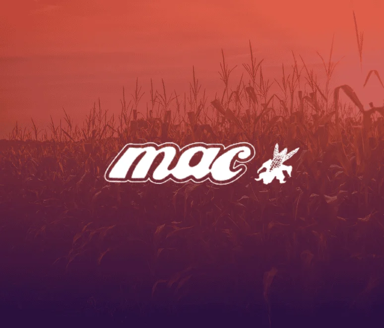 A cornfield at sunset with the word "mac" and a small winged figure logo displayed in the center.