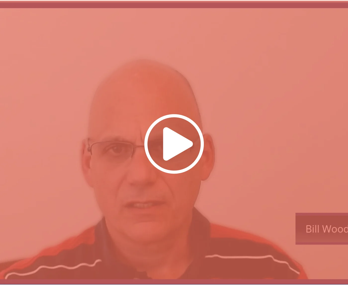 Video thumbnail of Bill Woods with a play button overlay.